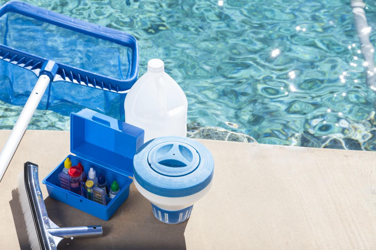 Pool cleaning kit with a pool net on side of an in-ground swimming pool