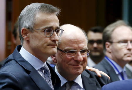 Luxembourg's Justice Minister Felix Braz (L) comforts his Belgian counterpart Koen Geens during an extraordinary meeting of European Union interior and justice ministers following Tuesday's bombings in Brussels, Belgium, March 24, 2016. REUTERS/Francois Lenoir