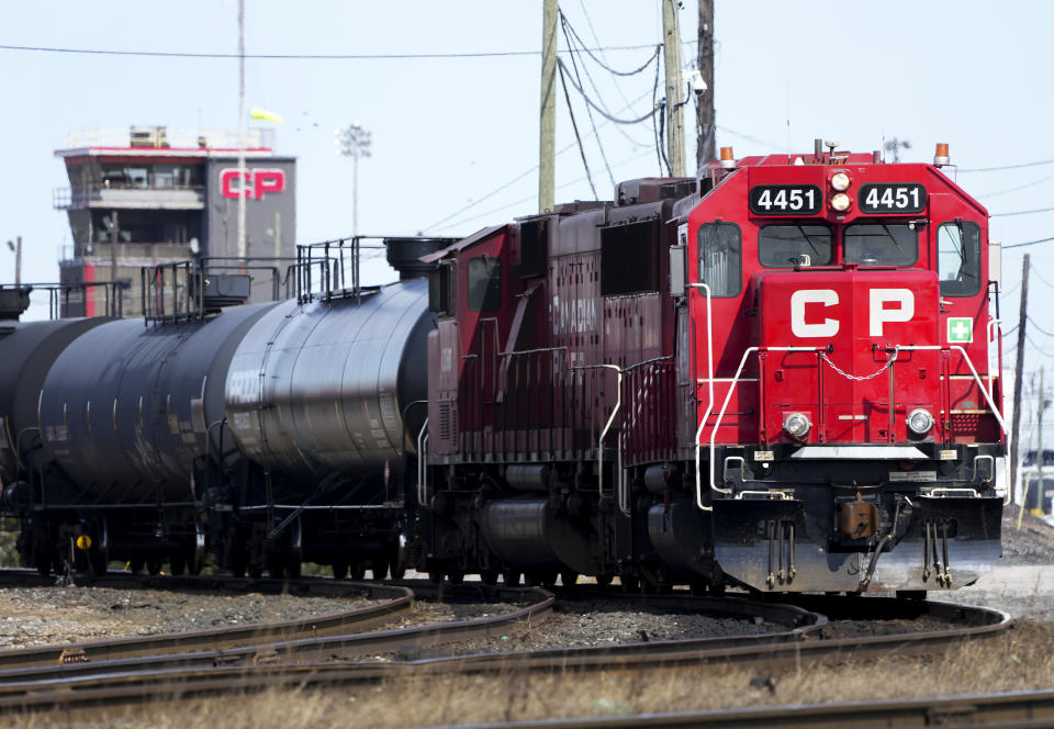 Canadian Pacific trains sit idle on the tracks due to a strike at the main CP Rail train yard in Toronto, March 21, 2022. The first major railroad merger since the 1990s could be approved Wednesday, March 15, 2023, when federal regulators announce their decision on Canadian Pacific's $31 billion acquisition of Kansas City Southern railroad. (Nathan Denette/The Canadian Press via AP)