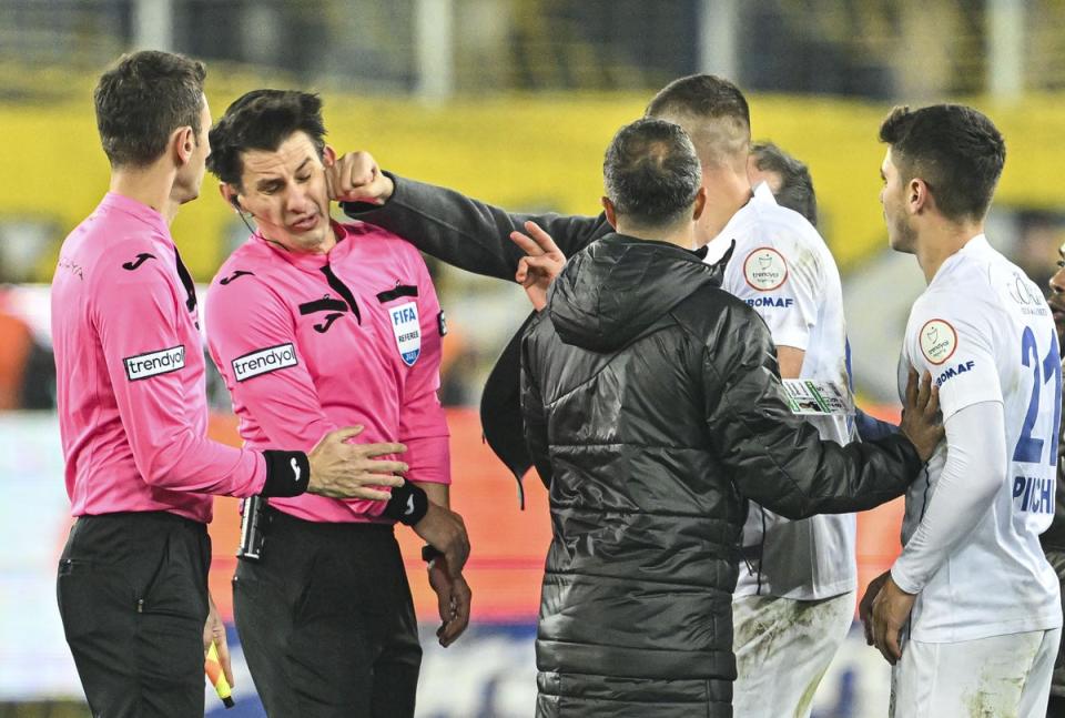 Turkish club president Faruk Koca punches referee Halil Umut Meler (Anadolu/Getty)