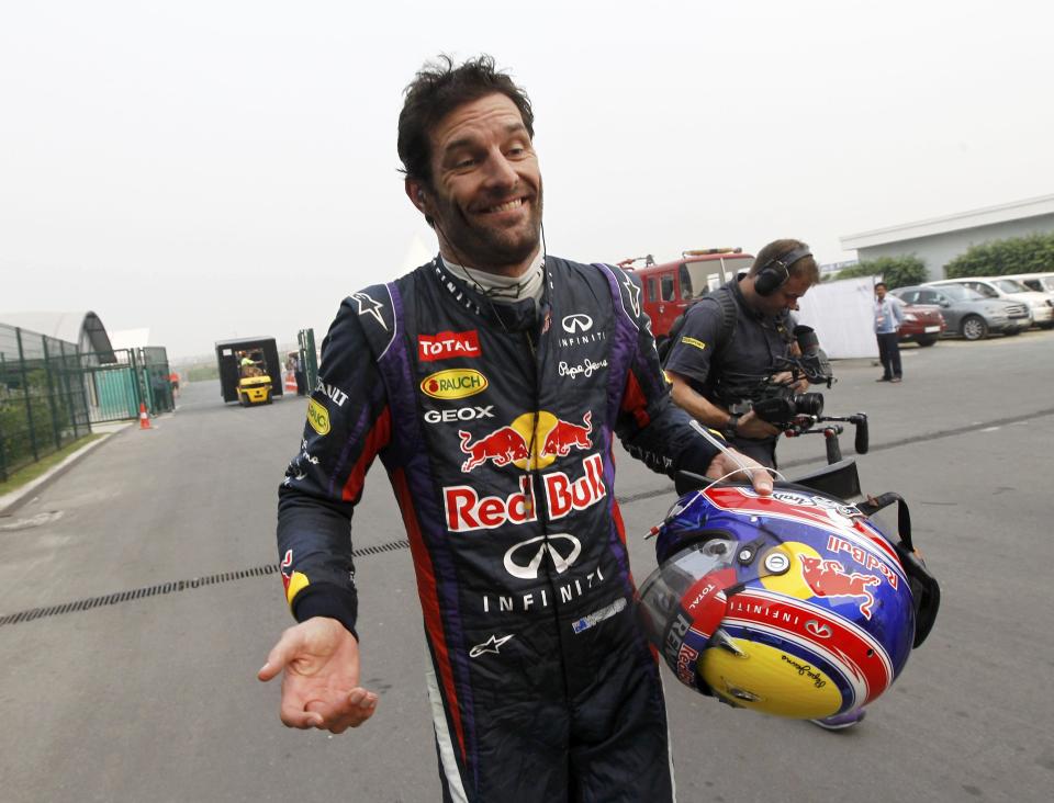 Red Bull Formula One driver Webber reacts as he returns to the garage area after he retired from the race during the Indian F1 Grand Prix at the Buddh International Circuit in Greater Noida