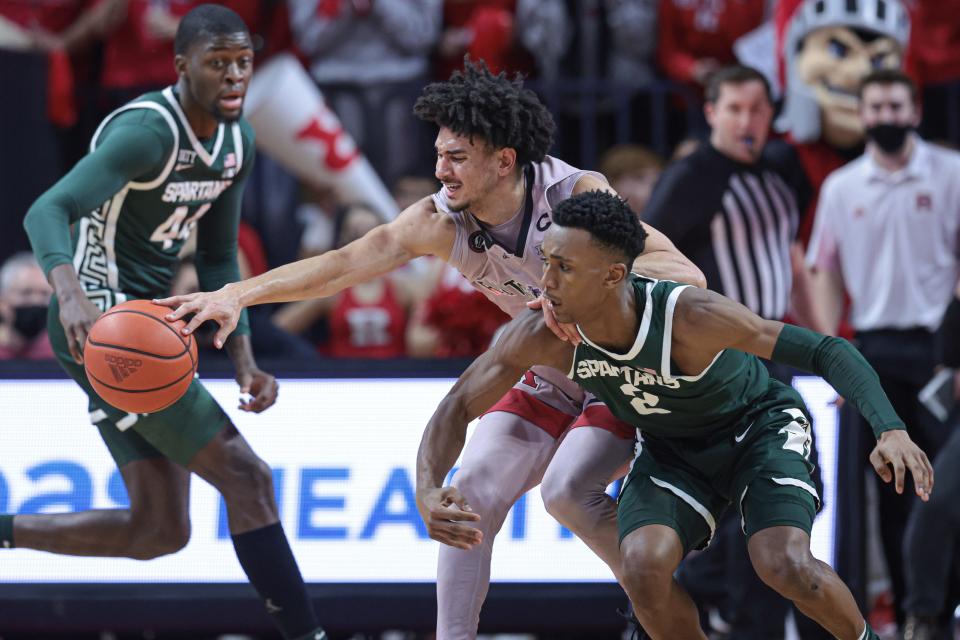 Rutgers Scarlet Knights guard Geo Baker (0) is fouled by Michigan State Spartans guard Tyson Walker (2) during the first half Feb. 5, 2022 at Jersey Mike's Arena.