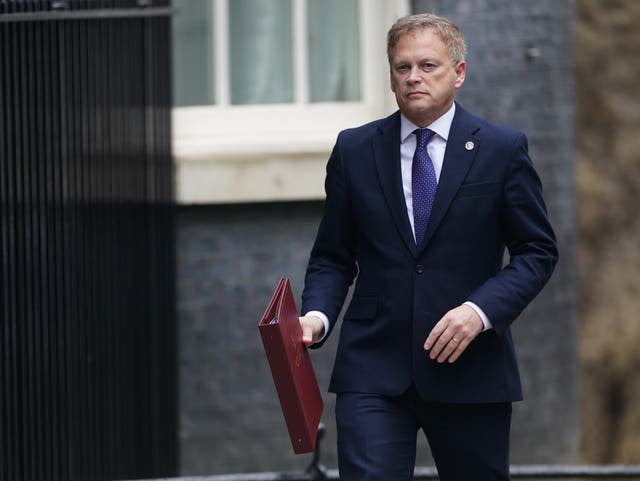 Defence Secretary Grant Shapps walking in Downing Street holding a folder