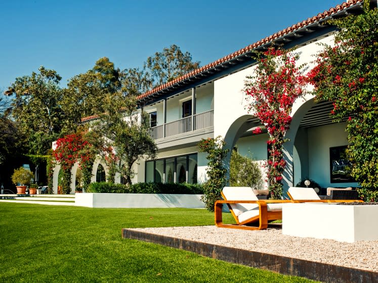 Lori Loughlin and Mossimo Giannulli sold their Bel-Air mansion, once owned by Charles Bronson, to Tinder co-founder Justin Mateen. The $18.75-million sale price was about half of what Loughlin and Giannulli had asked for the estate. The couple pleaded guilty in May to charges connected to the college admissions scandal. Renovated and expanded through the years, the 12,000-square-foot mansion with seven bedrooms and nine bathrooms overlooks the Bel-Air Country Club.