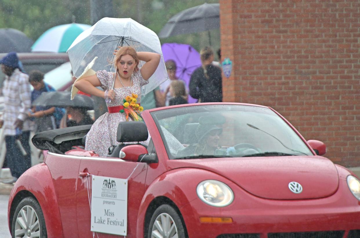 Miss Lake Festival Grace-Ellen Rison loses her hat as the rain falls on the 2023 Miss Ohio Parade on Sunday afternoon.