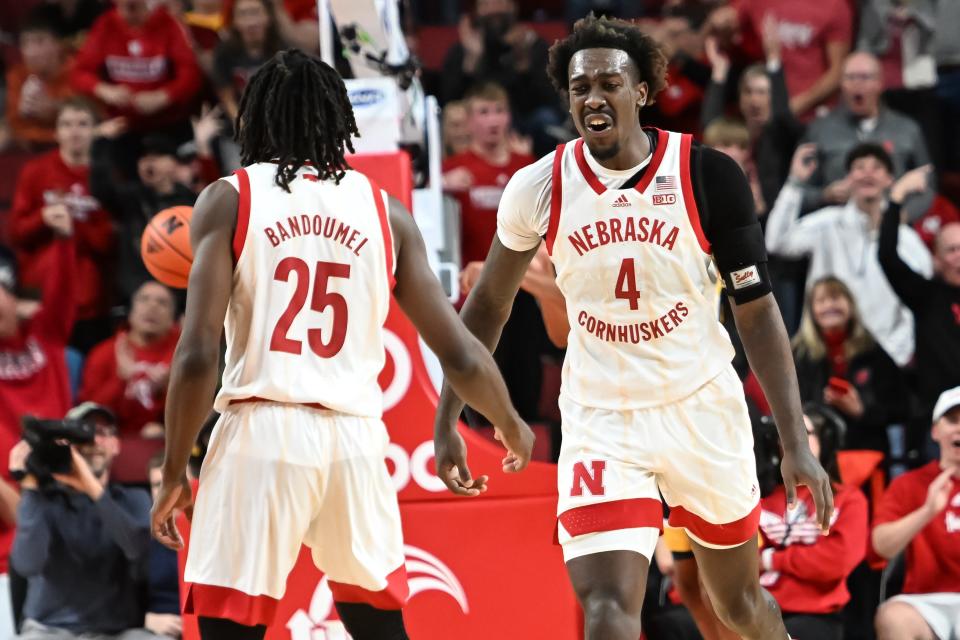 Nebraska forward Juwan Gary (4) celebrates a basket with guard Emmanuel Bandoumel (25) in the second half of their 66-50 win over Iowa last Thursday.