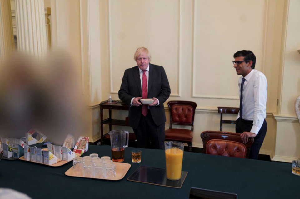 Boris Johnson and Rishi Sunak are seen at a gathering for the prime minister’s birthday on 19 June 2020 (UK Government)