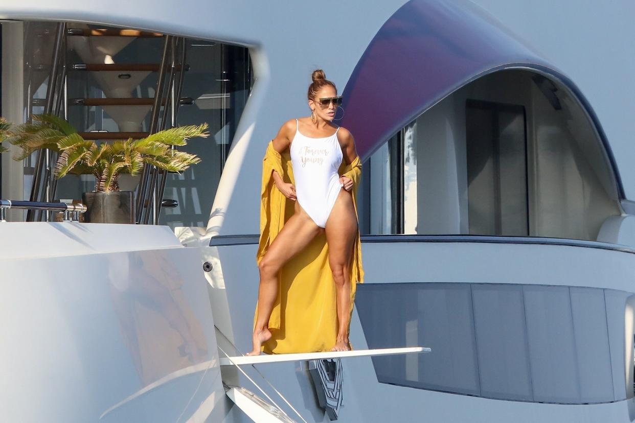 Jennifer Lopez poses for a photoshoot on a diving board on the deck of her yacht off St. Tropez during a trip with fiance Alex Rodriguez on Sept. 3, 2019.