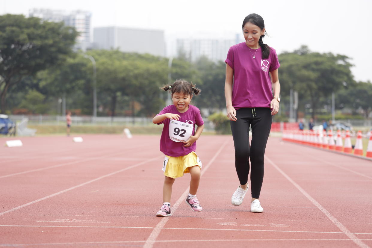 Para-athlete Ruri Fuchu, five, taking part in National Athletics Youth Championships. (PHOTO: Michael Tan/Singapore Disability Sports Council)