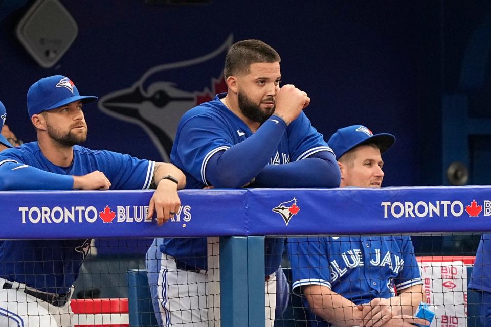 Toronto Blue Jays starting pitcher Alek Manoah stands in the dugout after getting pulled from Monday's game against the Houston Astros.