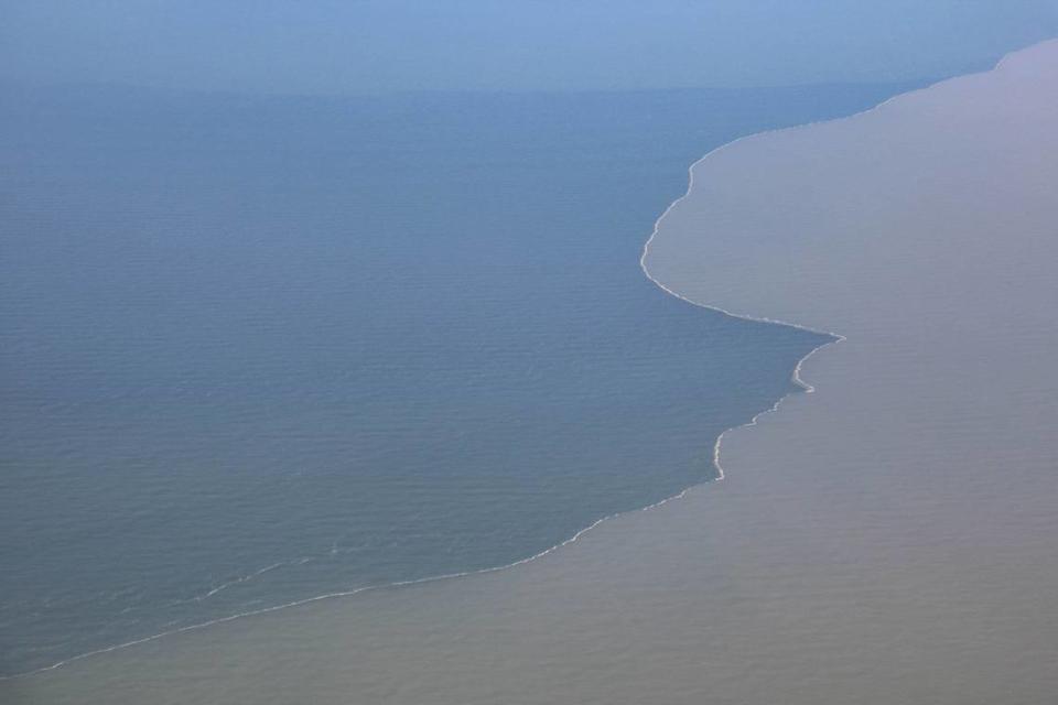 Murky, sediment-rich Mississippi River water mixes with saltwater in the Gulf of Mexico off the coast of Louisiana on June 7. The Mississippi River carries nutrient runoff from 41% of the United States to the gulf.