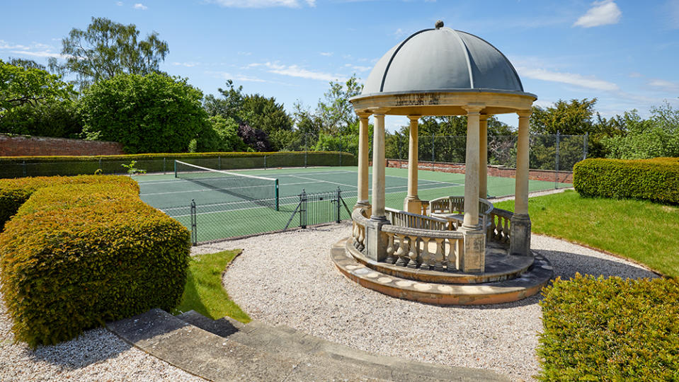 The tennis court with gazebo. - Credit: Photo: Knight Frank