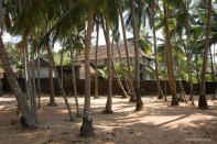 <p><b>A vernacular mosque seen through the tropical palms</b><br><em>©Donald Fels/ Published in ‘Mosques of Cochin’ by Patricia Tusa Fels</em><br>Sited in compounds replete with coconut palms, the mosques of Malabar offer an oasis of tranquility in the densely populated neighbourhoods. Large wood-framed pyramidal roofs, deep overhangs, and fine wooden craftsmanship distinguish a Kerala vernacular that reflects the climate, the culture and the materials of the place. The adoption and adaptation of the local vernacular by the Muslim congregations for their mosques is undocumented and unappreciated phenomenon.</p>
