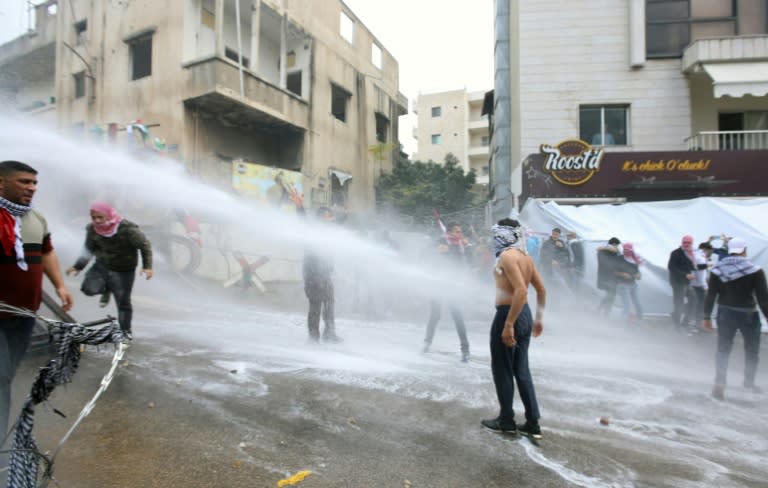 Lebanese security forces use a water cannon to disperse protestors during a demonstration outside the US embassy in Awkar, on the outskirts of the Lebanese capital Beirut, on December 10, 2017