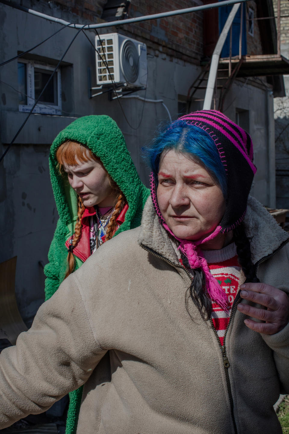 Gala and her daughter Veronika hid at home throughout the occupation in Bucha. Gala, with blue hair, said that the soldiers would come into her home twice a day threatening to kill them and terrorizing the neighborhood.<span class="copyright">Natalie Keyssar</span>