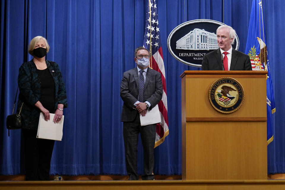 Deputy Attorney General Jeffrey Rosen speaks, as Susan Parker Bodine, Environmental Protection Agency (EPA) Assistant Administrator for Enforcement and Compliance Assurance, left, and EPA Administrator Andrew Wheeler, center, look on, during a news conference at the Justice Department in Washington, Monday, Sept. 14, 2020. Automakers Daimler AG and subsidiary Mercedes-Benz USA have agreed to pay $1.5 billion to the U.S. government and California state regulators to resolve emissions cheating allegations. (AP Photo/Susan Walsh, Pool)