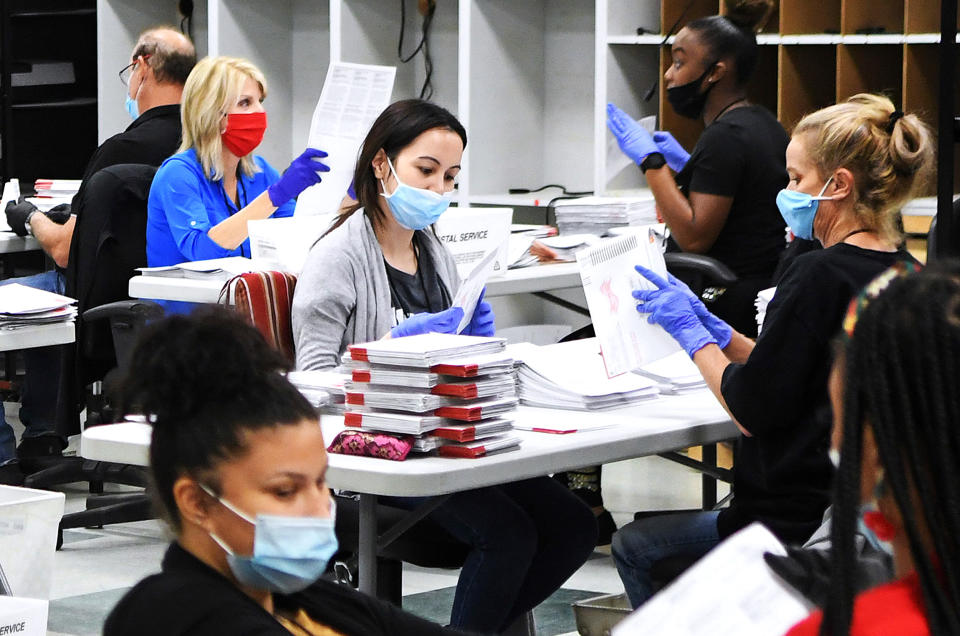 IMAGE: Election workers in Orlando (Paul Hennessy / NurPhoto via Getty Images)