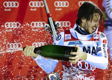 Felix Neureuther of Germany celebrates with champagne after winning the men's World Cup Slalom skiing race in Madonna di Campiglio December 22, 2014. REUTERS/Stefano Rellandini