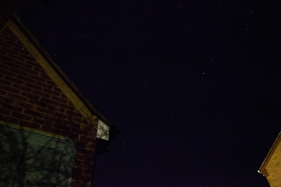 The night sky with house in foreground