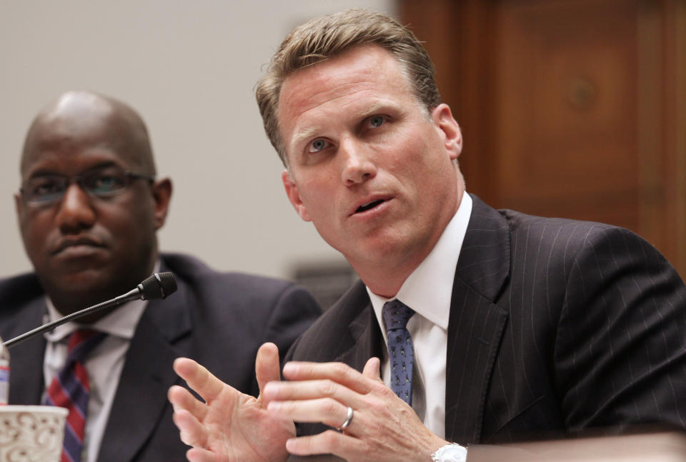 Former NFL player Patrick Eilers testifies at the House Committee on Education and Workforce on college athletes forming unions as Stanford Athletic Director Bernard Muir looks on, left, on May 8, 2014 on Capitol Hill in Washington. (AP Photo/Lauren Victoria Burke)