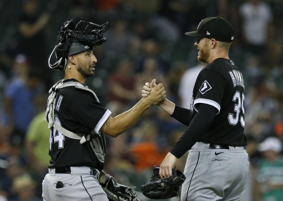 Chicago White Sox catcher Seby Zavala, left, celebrates with pitcher Aaron Bummer after a win over the Detroit Tigers in 11 innings of a baseball game Saturday, Sept. 17, 2022, in Detroit. (AP Photo/Duane Burleson)