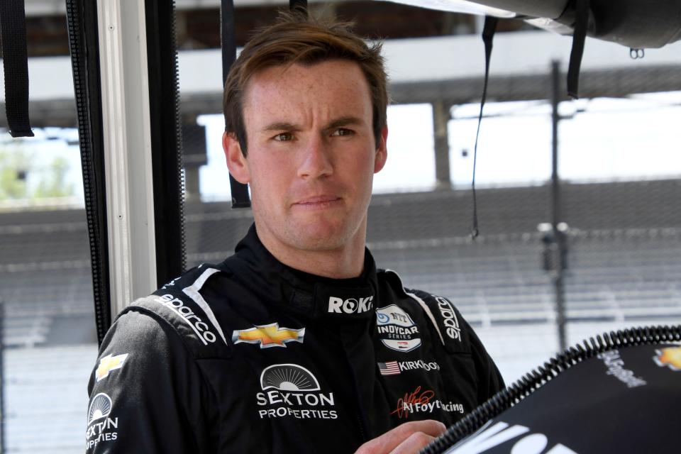 A. J. Foyt Enterprises driver Kyle Kirkwood (14) stands in his pit box Tuesday, May 17, 2022, during the first day of Indianapolis 500 practice at Indianapolis Motor Speedway. 