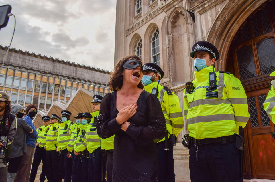 <p>LONDON, UNITED KINGDOM - 2021/08/22: A protester wearing a mask gives an emotional speech during the demonstration. Extinction Rebellion protesters gathered at Guildhall for the opening ceremony of their two-week Impossible Rebellion campaign, which will target the City of London, the capital's financial hub. (Photo by Vuk Valcic/SOPA Images/LightRocket via Getty Images)</p>
