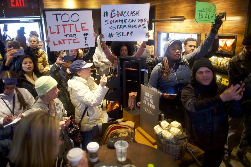 Protesters&nbsp;demonstrate in a&nbsp;Philadelphia Starbucks on April 15, 2018, days after an employee at a Starbucks in that city called the police to report two black men waiting to meet a friend. (Photo: Mark Makela via Getty Images)