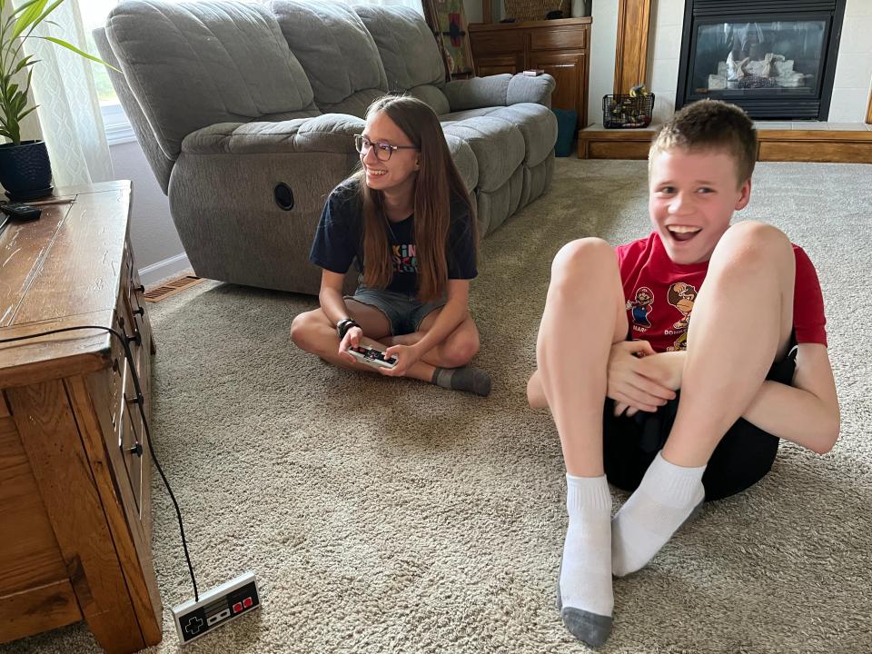 Brandon Lust and Alli Maile playing a round of Mario at Maile's home in Ankeny, Iowa.