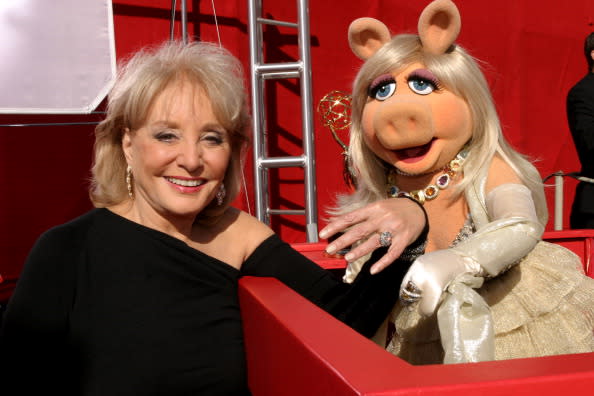 Barbara Walters and Miss Piggy show off their bling at the Emmy Awards in 2004.