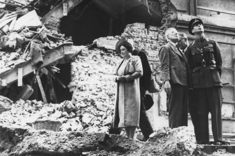 Britain's King George VI (R) and Queen Elizabeth (L) view damage at the cinema attached to Madame Tussaud's on September 19, 1940, during one of their tours of London areas affected by the German bombings. On August 8, 1940, the German Luftwaffe began a series of daylight air raids on Britain. UPI File Photo
