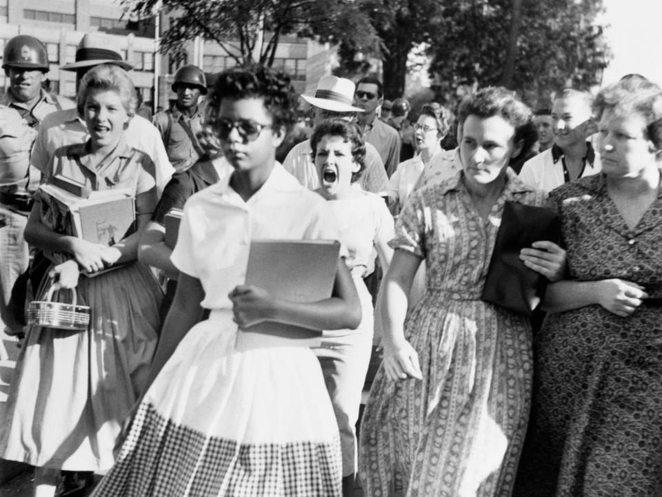 Elizabeth Eckford ignores the hostile screams and stares of fellow students on her first day of school, 6th September 1957.