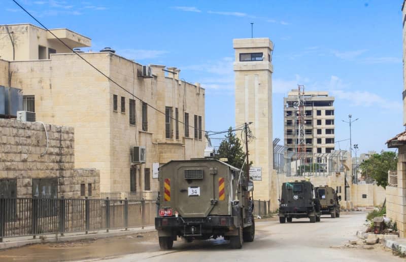 Israeli military reinforcements storm the city of Jenin during the invasion, north of the occupied West Bank. Israeli forces entered the cities of Jenin, Tubas, Tulkarm and the Far'a refugee camp, with thousands of Israeli soldiers simultaneously taking part in the raids. Eleven Palestinians were killed, dozens wounded and infrastructure, streets and homes were destroyed. Nasser Ishtayeh/SOPA Images via ZUMA Press Wire/dpa