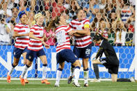 Sydney Leroux #11, Megan Rapinoe #15 and Lauren Cheyney #12 of the USA congratulate teammate Abby Wambach #20 on a second half goal in front of Zhang Yue #1 of the China at PPL Park on May 27, 2012 in Chester, Pennsylvania. USA won 4-1. (Photo by Drew Hallowell/Getty Images)