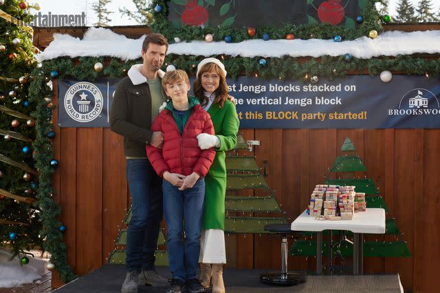 2023 Hallmark Media/Photographer: Allister Foster Lucas Bryant, Aias Dalman, Nikki DeLoach in 'A World Record Christmas'