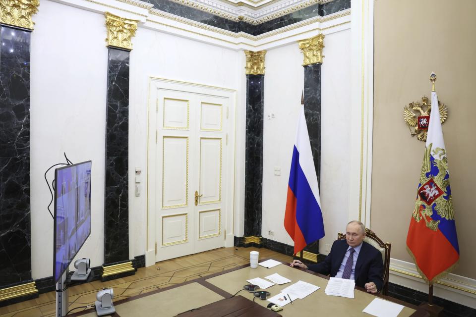 Russian President Vladimir Putin attends a meeting of the Presidential Council for Science and Education via videoconference at the Kremlin in Moscow, Russia, Thursday, Feb. 8, 2024. (Alexander Kazakov, Sputnik, Kremlin Pool Photo via AP)