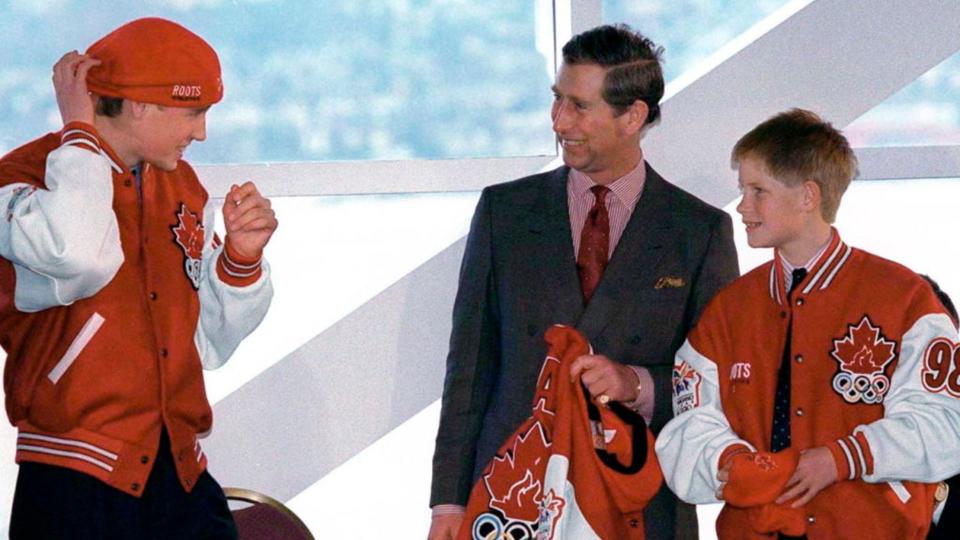 Princes William and Harry, and King Charles wearing Canadian Olympic memorabilia