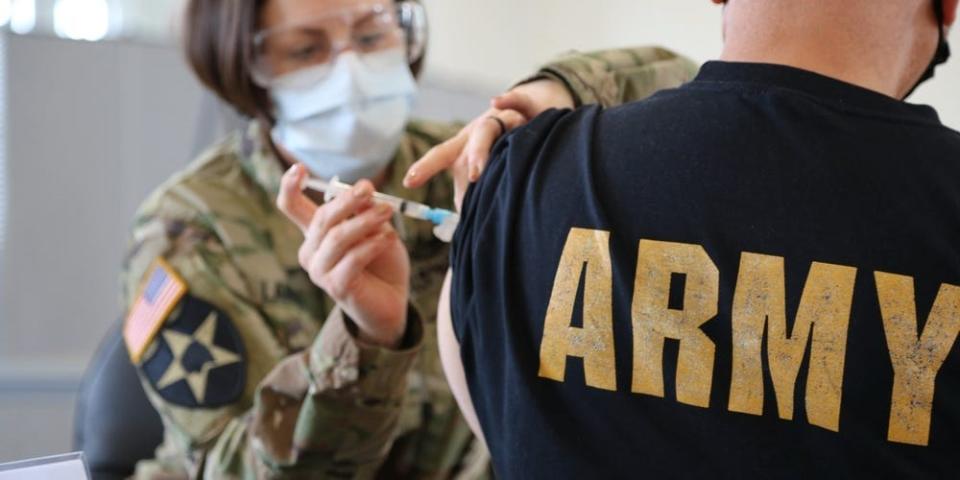 US Army nurse administers COVID-19 vaccine at Fort Meade in Maryland.