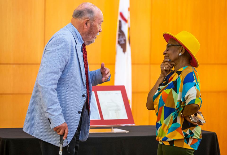 Guy Fraker, left, of Bloomington, Ill., and Kathryn Harris, right, visit after a ceremony in which Fraker donated a 1854 handwritten letter from Lincoln for the collection of the ALPLM during a ceremony at the Abraham Lincoln Presidential Library in Springfield, Ill., Thursday, July 1, 2021. Abraham Lincoln’s 1854 letter to Elihu Powell says that he has decided not to serve as a state representative again and according to scholars meant that he had his sights on the U.S. Senate. [Justin L. Fowler/The State Journal-Register] 