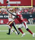 <p>Washington Redskins quarterback Alex Smith (11) throws under pressure from Arizona Cardinals defensive end Benson Mayowa during the first half of an NFL football game, Sunday, Sept. 9, 2018, in Glendale, Ariz. (AP Photo/Rick Scuteri) </p>