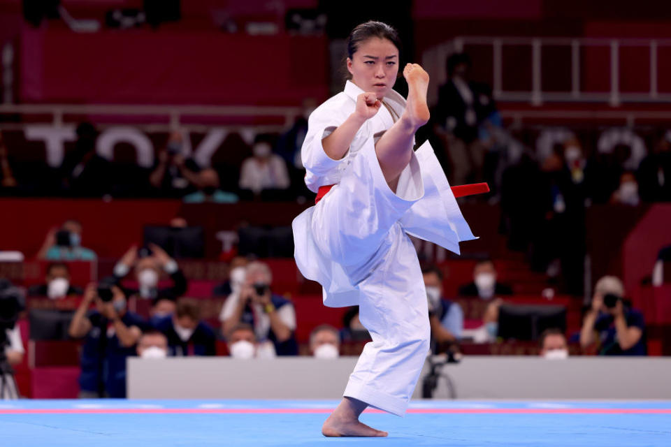 Kokumai kicks in the air during the Women's Karate Kata Elimination Round