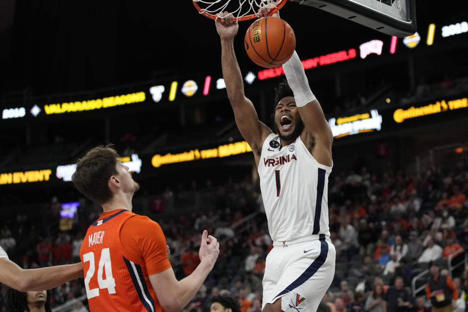 Virginia's Jayden Gardner (1) dunks against Illinois during the second half of an NCAA college basketball game Sunday, Nov. 20, 2022, in Las Vegas. (AP Photo/John Locher)