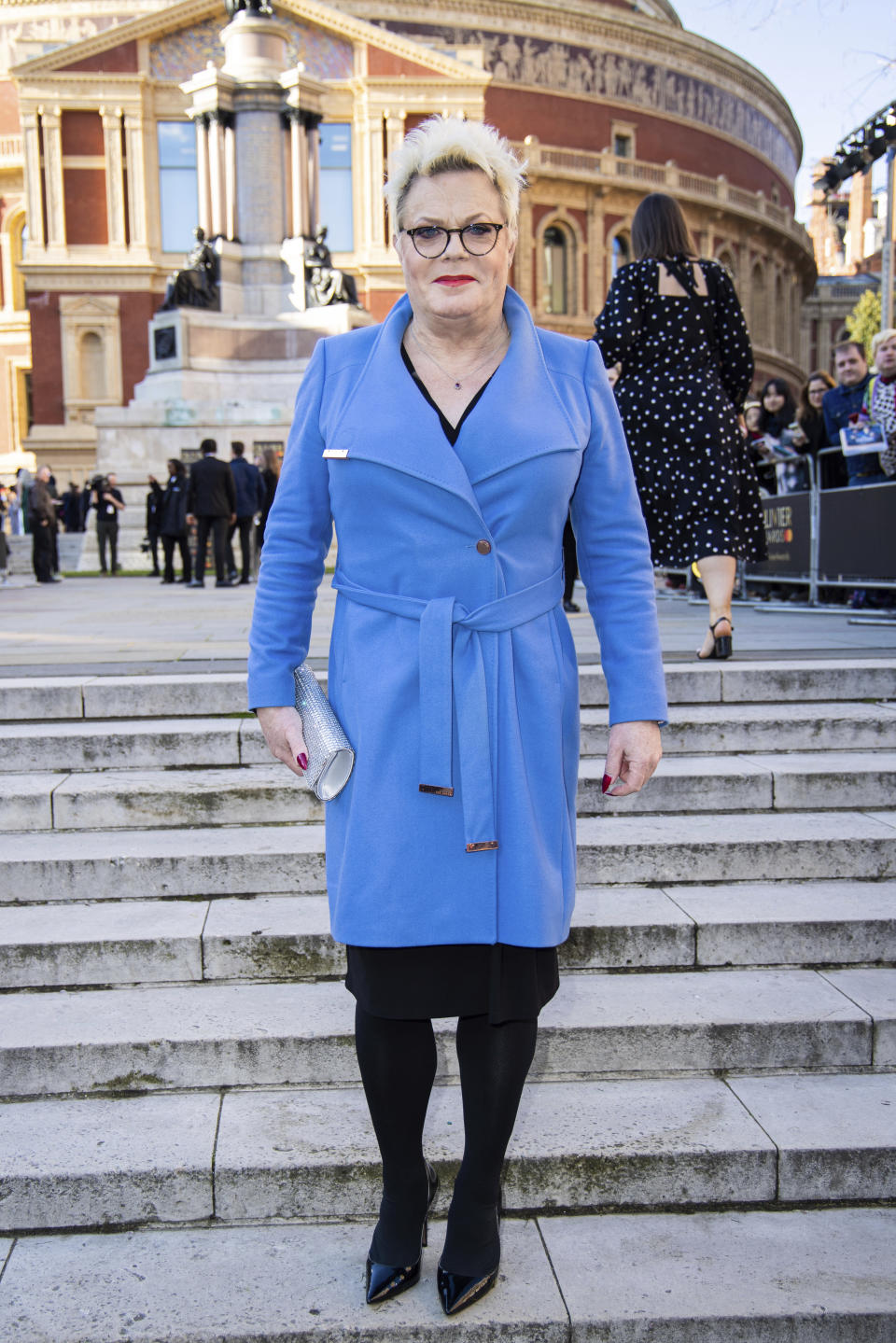 Suzy Eddie Izzard poses for photographers upon arrival at the Olivier Awards in London, Sunday, April 2, 2023. (Photo by Vianney Le Caer/Invision/AP)
