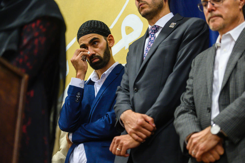 FILE - In this Aug. 11, 2019, file photo, Hamid Hayat wipes tears as he stands with his legal team, and family members during a news conference Sunday that coincided with an Eid al-Adha celebration, in Sacramento, Calif. Federal prosecutors in California on Friday, Feb. 14, 2020, ended what once was among the nation's highest profile anti-terrorism cases, after a judge earlier overturned Hayat's conviction that grew from conspiracy allegations in the wake of the 2001 terrorist attacks. Hayat, a cherry picker from the community of Lodi, Calif., was freed in August after spending more than 14 years in prison. (Daniel Kim/The Sacramento Bee via AP, File)
