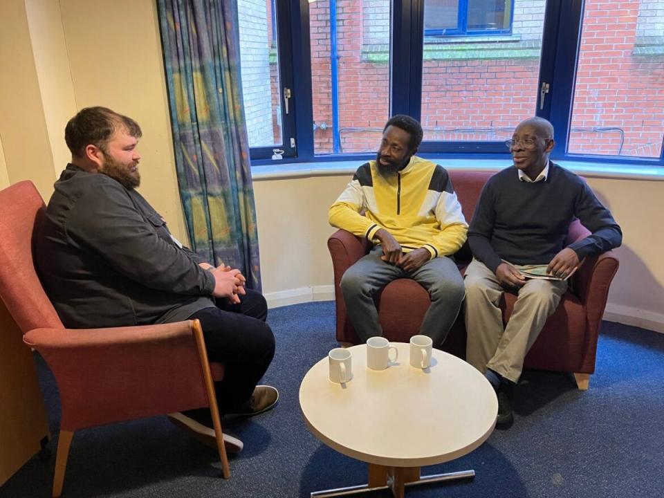 Salvation Army staff member Louis Juster (left) with residents at St Ann’s shelter in central London (The Salvation Army)