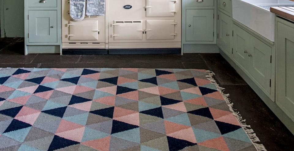 <p> Incorporating a rug into your kitchen can completely transform, even hide, your existing floor to make it feel instantly new and updated.&#xA0; </p> <p> Often rugs are overlooked for kitchen spaces with the misconception that they are only for living rooms but they can be just as integral for changing the decor in a kitchen. </p> <p> &quot;Adding a rug to your&#xA0;kitchen&#xA0;in warm tones that fit in with the color scheme of your cabinetry, worktops or tiles can help add depth to your&#xA0;kitchen, particularly if you have tiled, laminate or hardwood flooring,&#x201D; explains Looeeze Grossman, founder of&#xA0;The Used&#xA0;Kitchen&#xA0;Company.&#xA0; </p> <p> Looeeze goes on to explain how this simple accessory can also play a huge part in making your interiors cozy. &#x201C;A runner between the island and your back run or even a rug in front of the bi-folds can add that little bit of coziness needed to transition your open space from the bright and light space of summer to the cozy and warm space of winter.&#x201D; </p> <p> <br> </p>