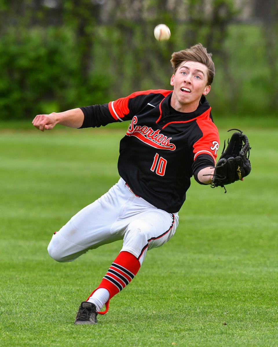 ROCORI's Beck Loesch dives to make a catch during the game Tuesday, May 31, 2022, in Cold Spring.