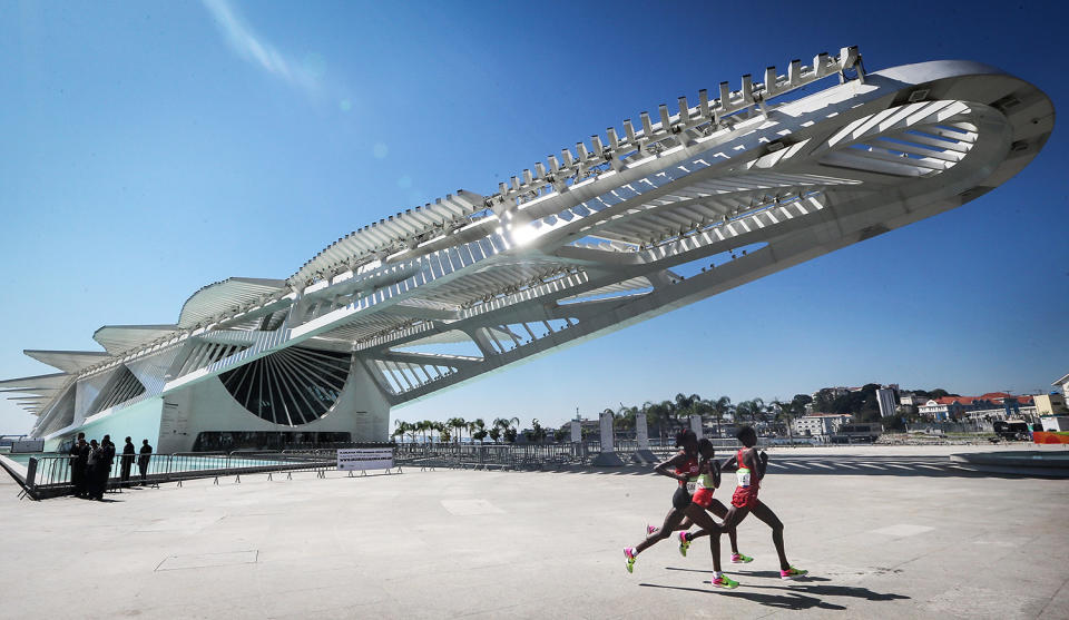 <p>Runners pass the Museum of Tomorrow in the Women’s Marathon on Day 9 of the Rio 2016 Olympic Games on August 14, 2016 in Rio de Janeiro, Brazil. (Photo by Mario Tama/Getty Images) </p>