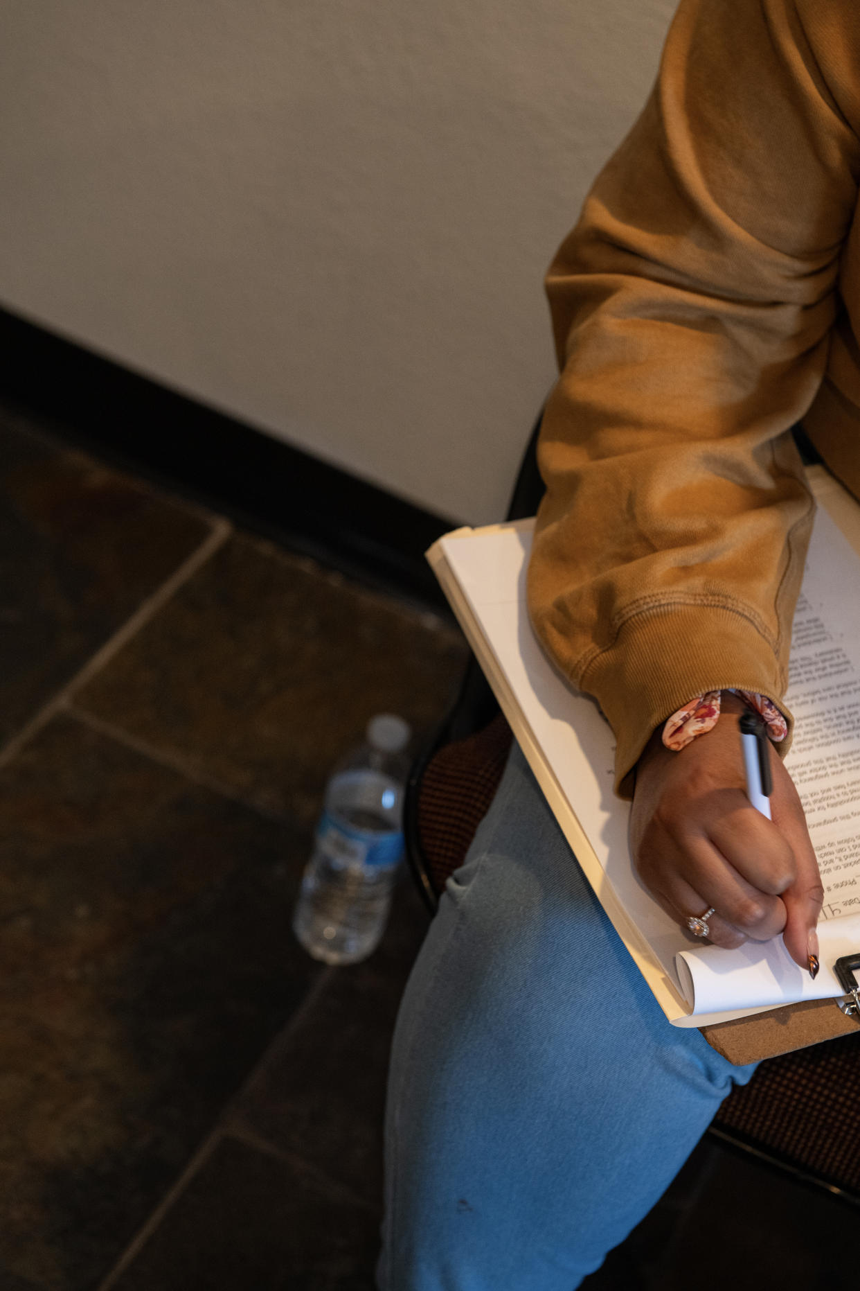 A patient signs consent documents for an abortion at a clinic in Phoenix, on April 12, 2024. (Caitlin O