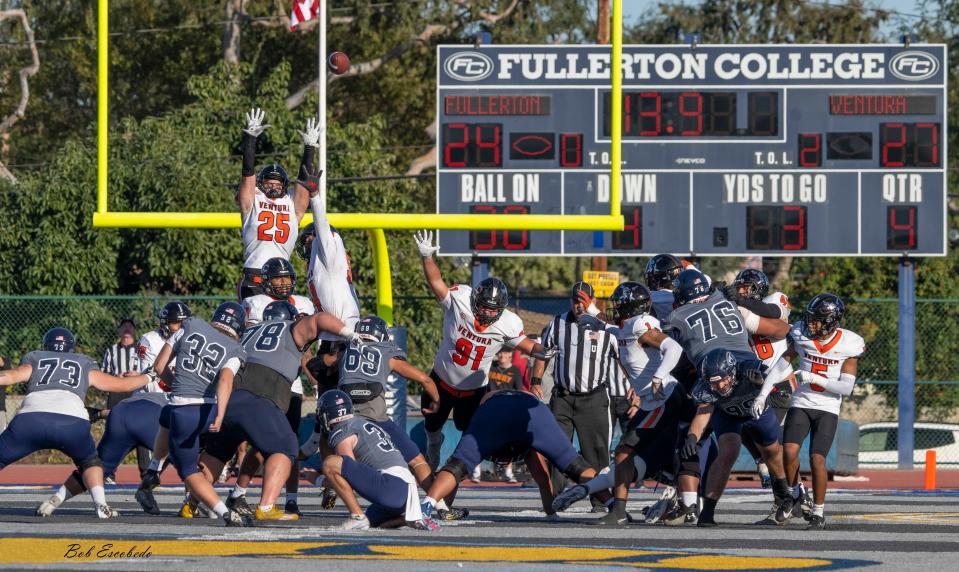 Ventura College safety Zane Carter (25) leaps in an attempt to block Fullerton College potential game-tying field goal last Saturday in the Southern California semifinals. The kick was short and VC won, 27-24.